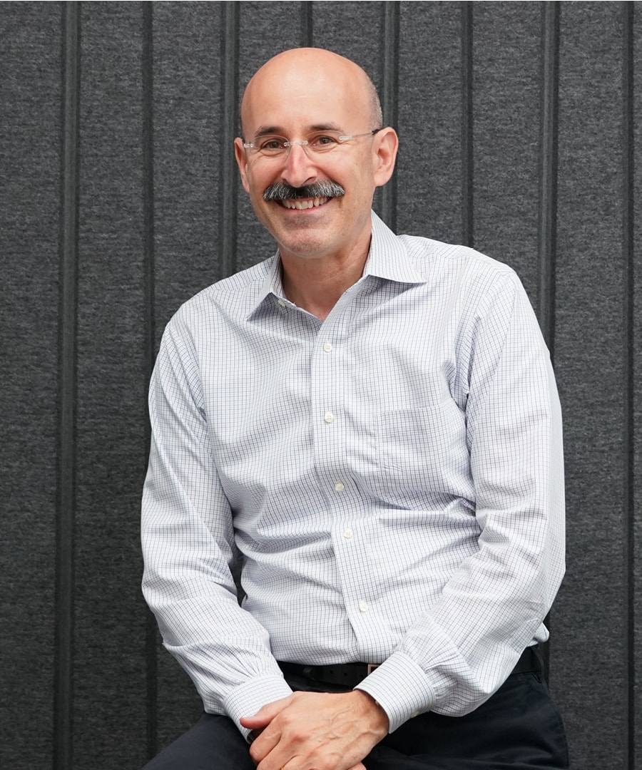 Portrait of man against a gray background