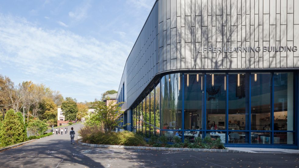 view uphill of the upper learning building and campus path