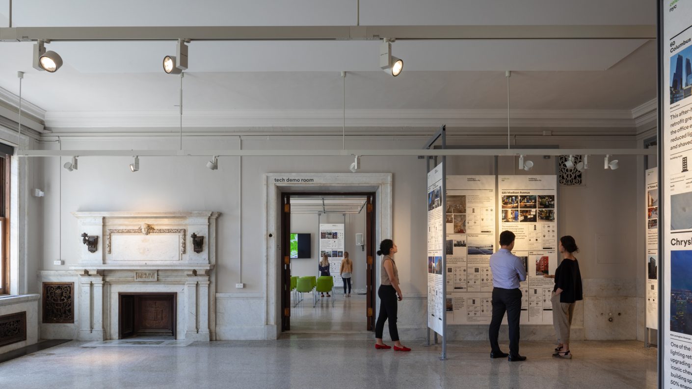 people reading BE-Ex exhibition panels