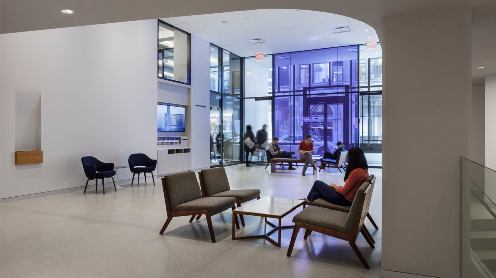 curved ceiling over a seating area in a wide open lobby