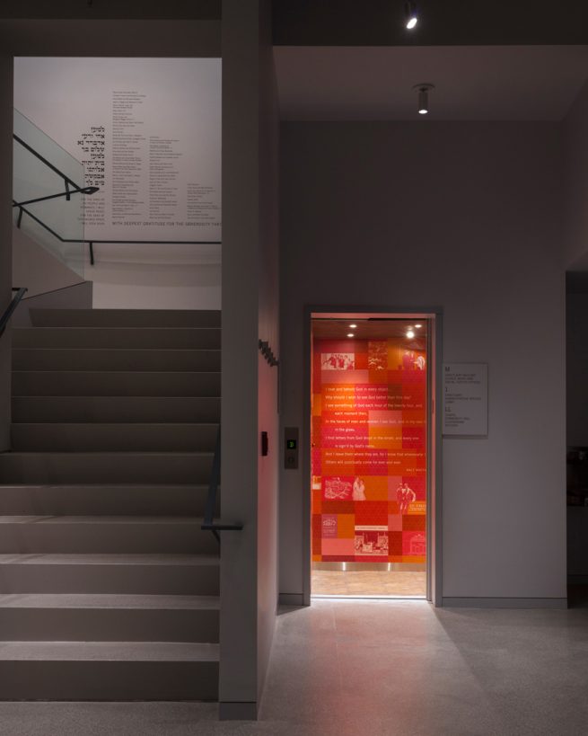 lower level staircase and open elevator wrapped in red