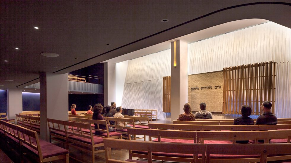 a congregation in the sanctuary with the Ark open