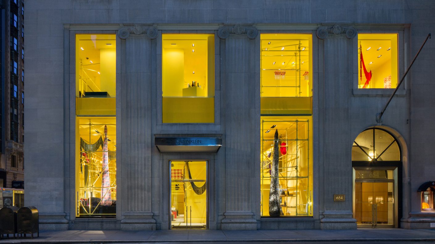 Calvin Klein Flagship storefront shining yellow from Madison Avenue