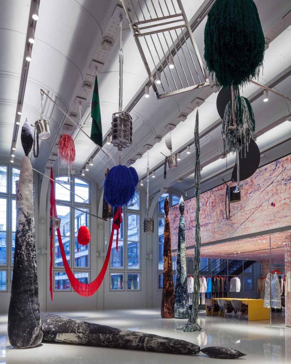 sterling ruby sculptures in the center of Calvin Klein Paris showroom in front of high 19th-century windows