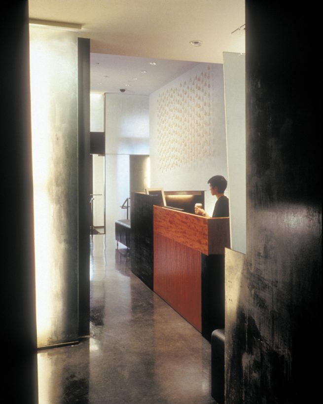 cherry wood and blackened steel at reception area