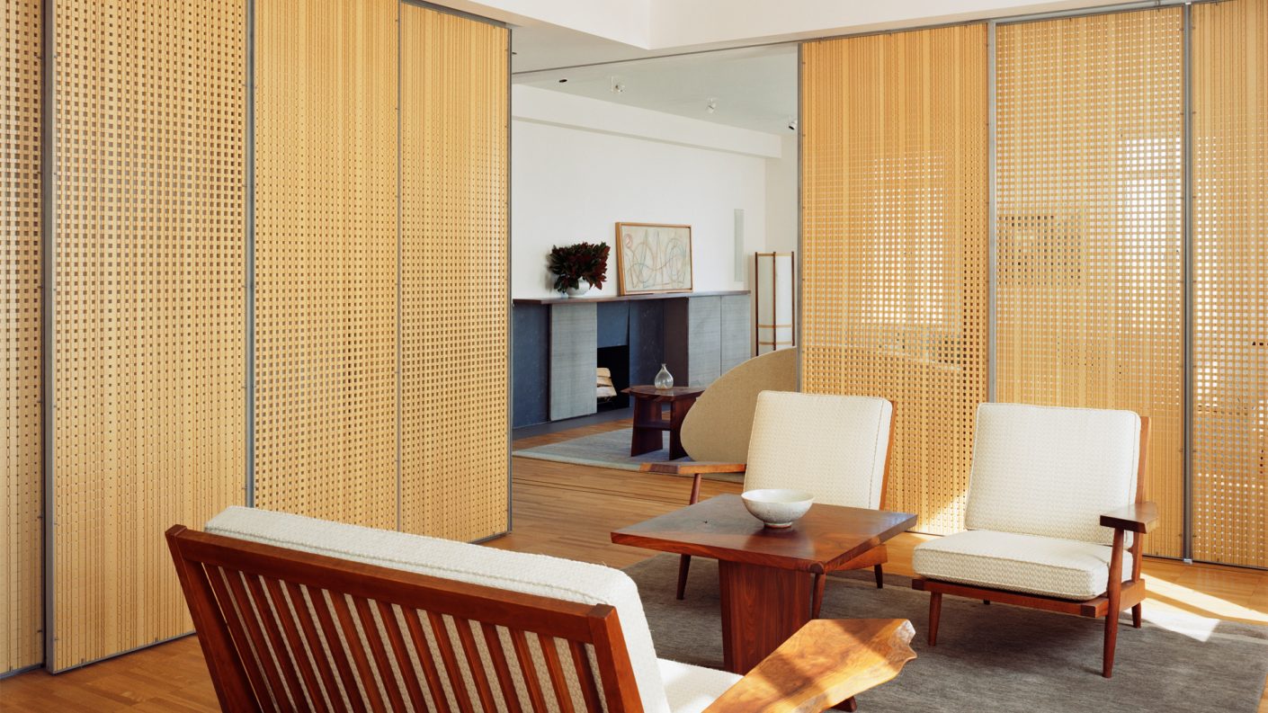 sliding wooden screens surround a sitting room