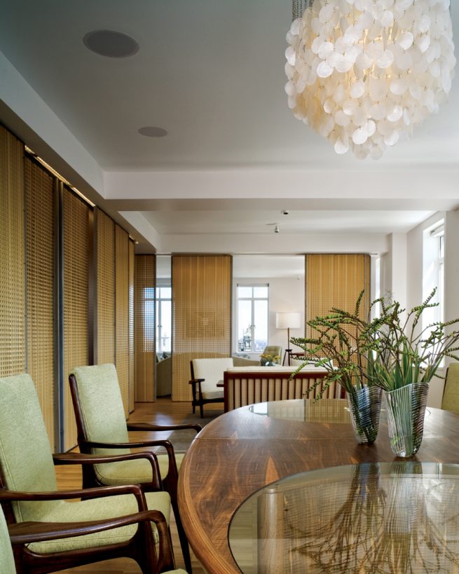 dining room and table surrounded by sliding screen doors