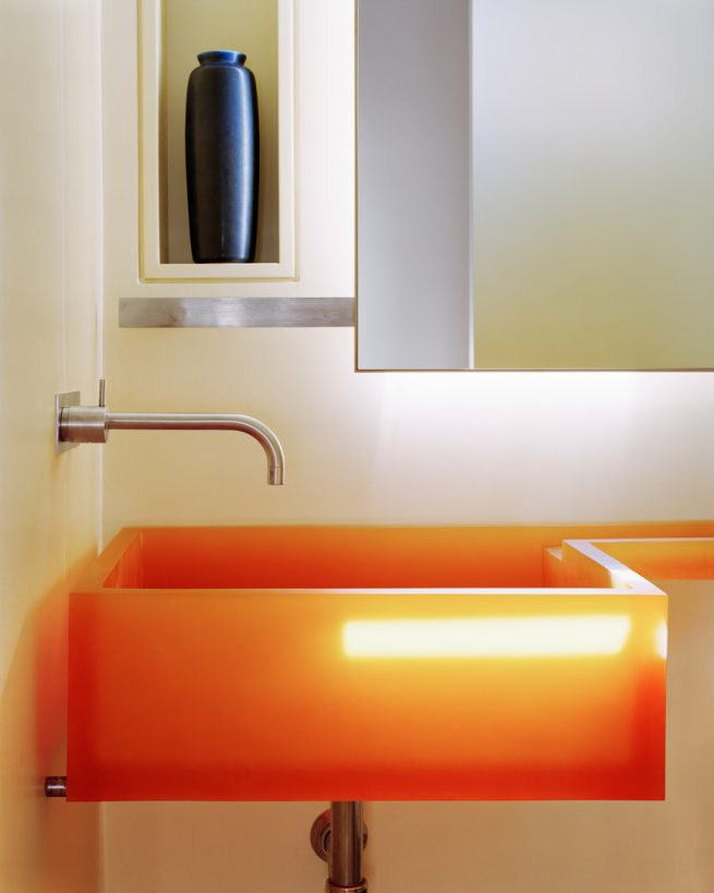 modern sink in semi-translucent orange resin