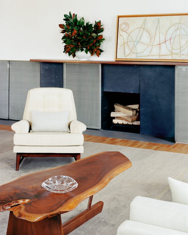 chair and coffee table in front of fireplace