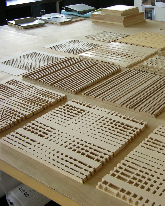 lasercut pattern studies laid out on a table