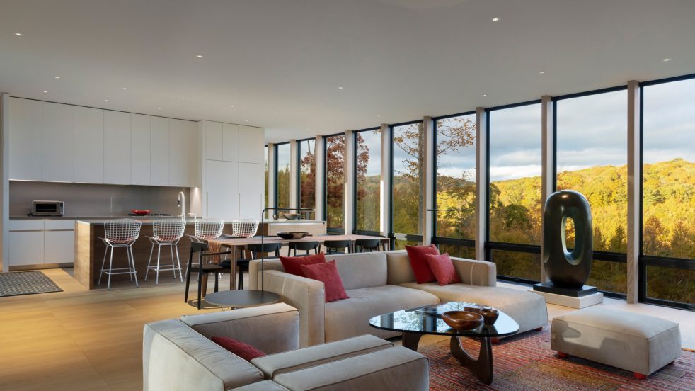 view looking from living room into kitchen and dining area, and valley views beyond
