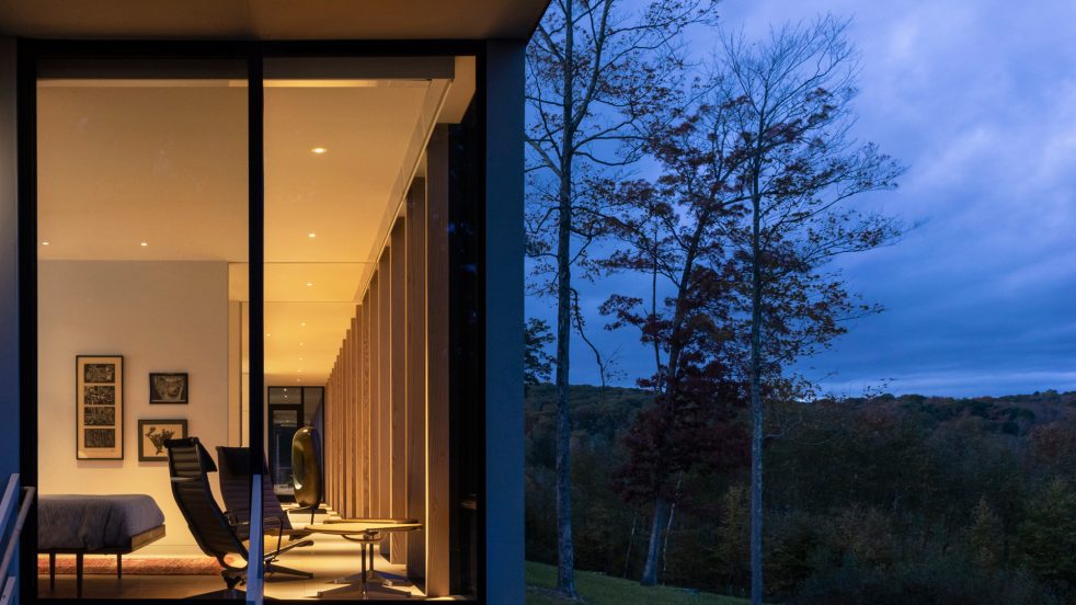 partial view from the exterior house corner into master bedroom through the length of the house