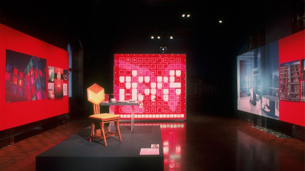 chair on display in center of exhibition gallery