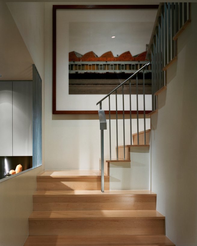 large photograph over staircase landing