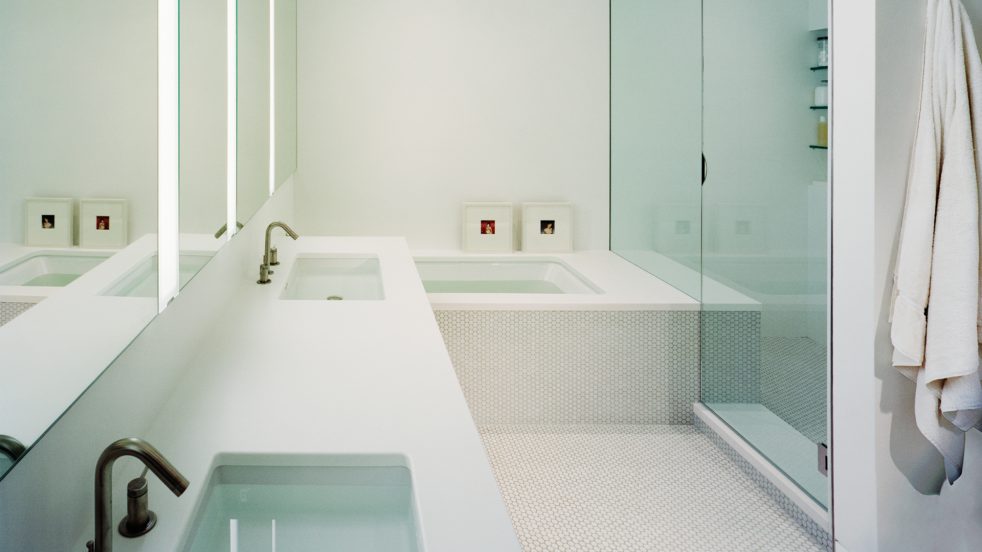 sinks, bathtub, and shower in white minimalist bathroom