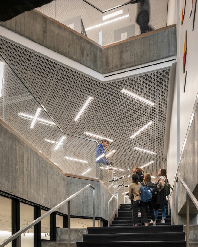 Students congregate on staircase under GFRG ceiling