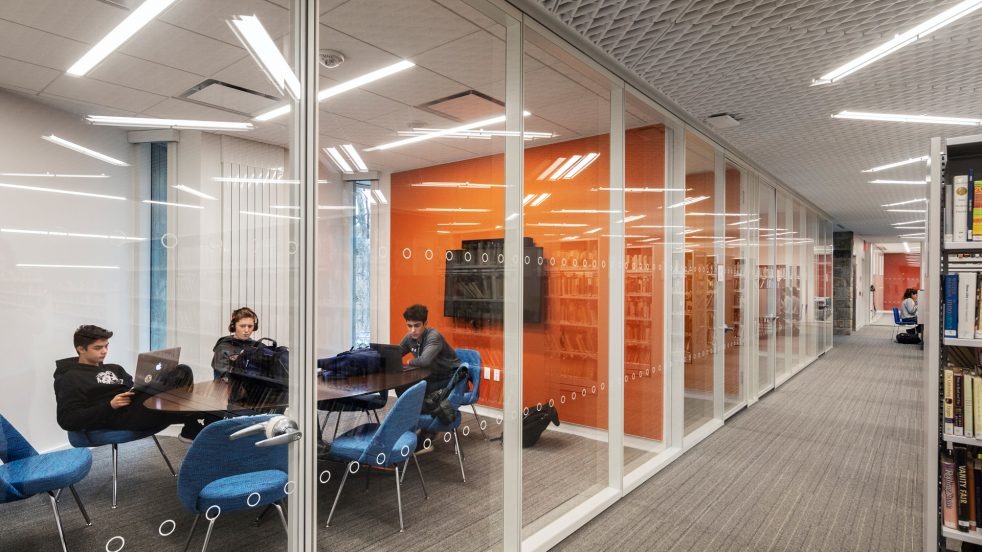 students work in an enclosed collaboration room