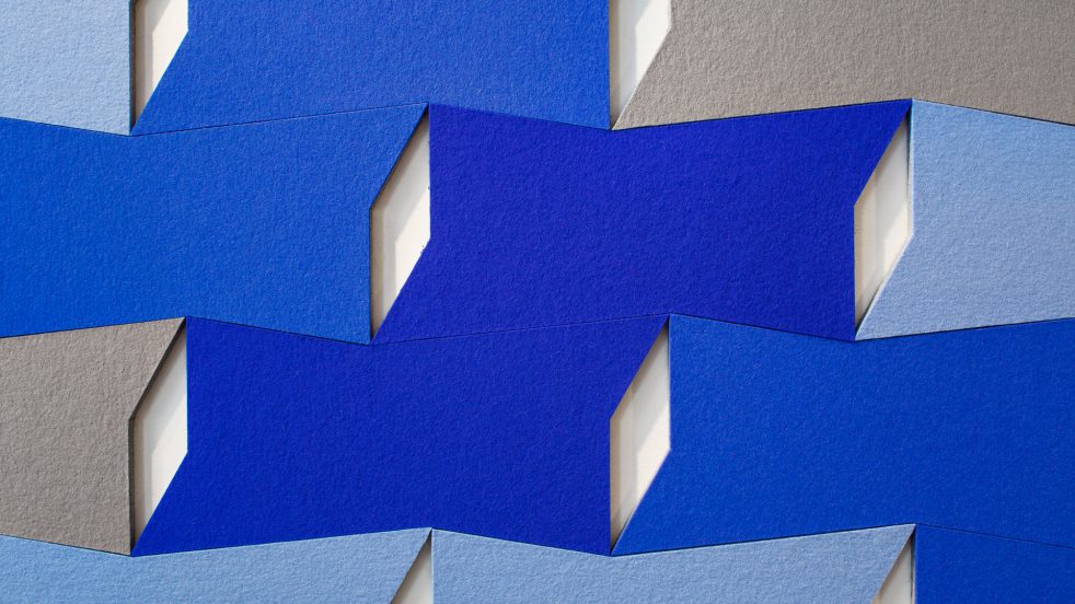 detail of the geometric blue, light blue, and grey panels of ARO Block 3
