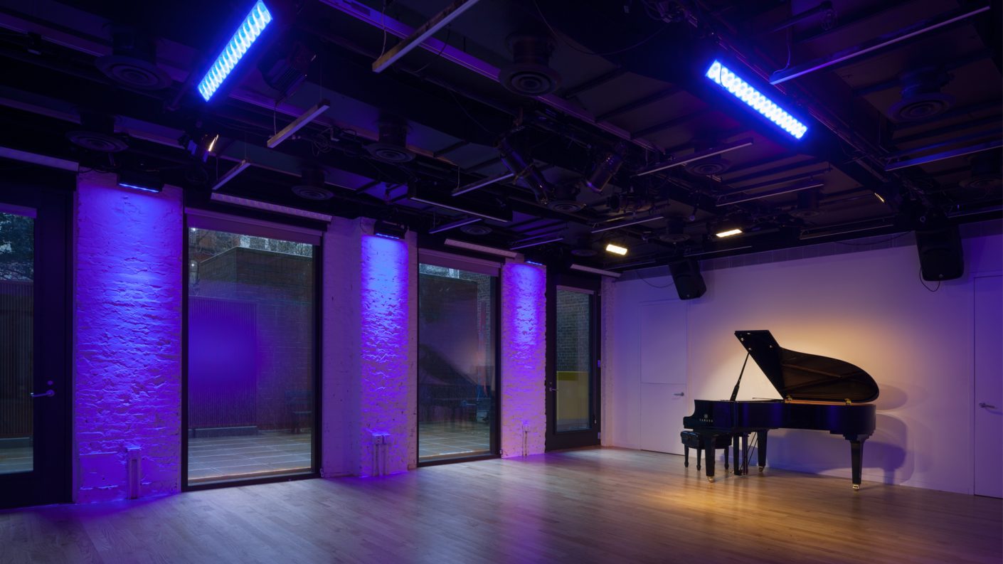 piano and lighting in The Pete Theater with view of the garden