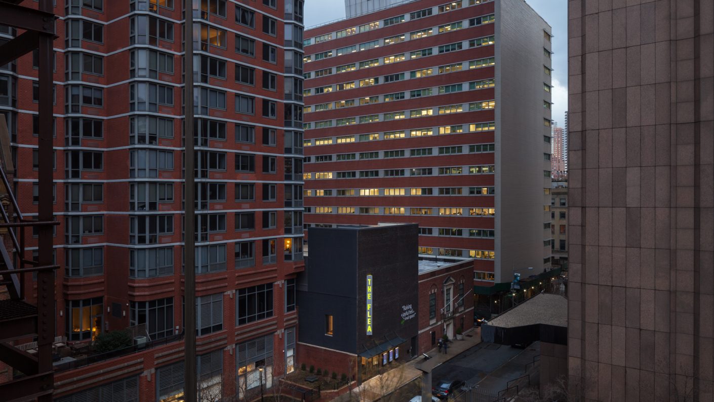 the Flea surrounded by large TriBeCa buildings