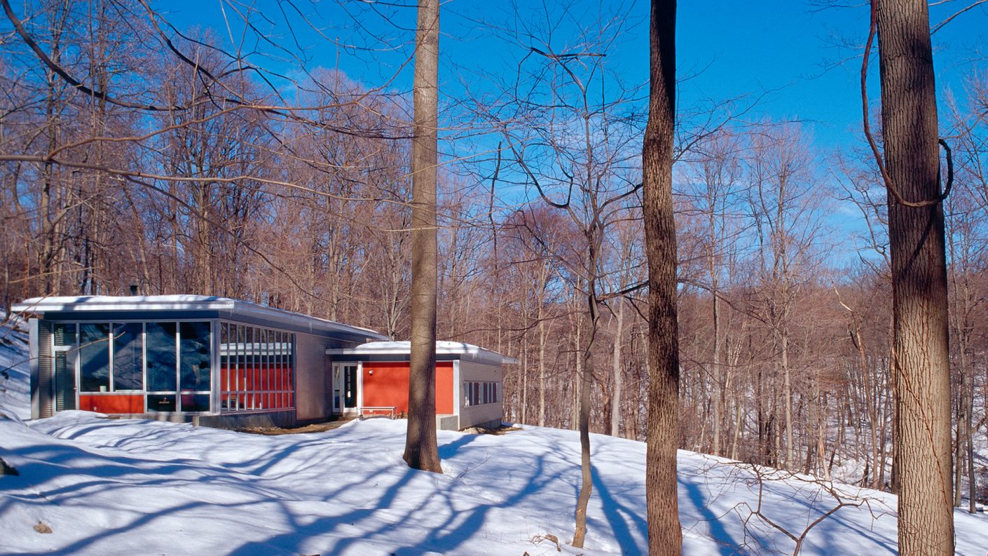 garrison house in snowy wooded area in the daytime