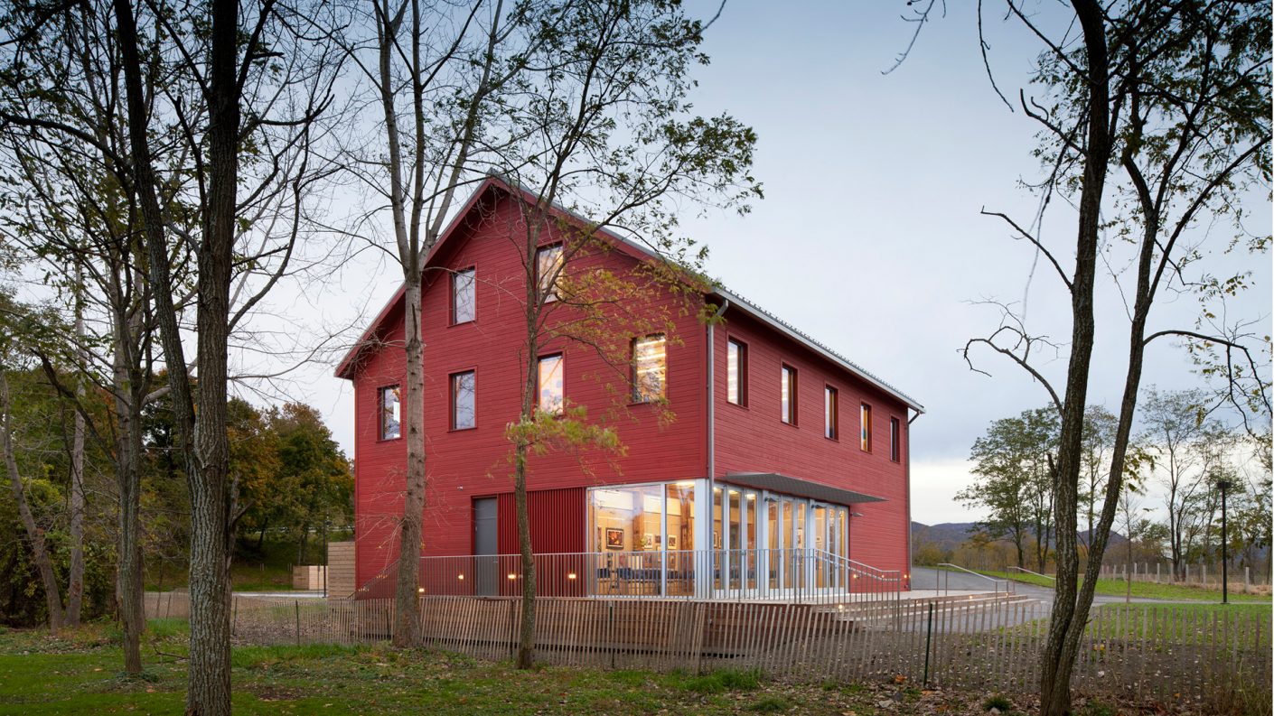Hudson River Center, a red barn surrounded by trees