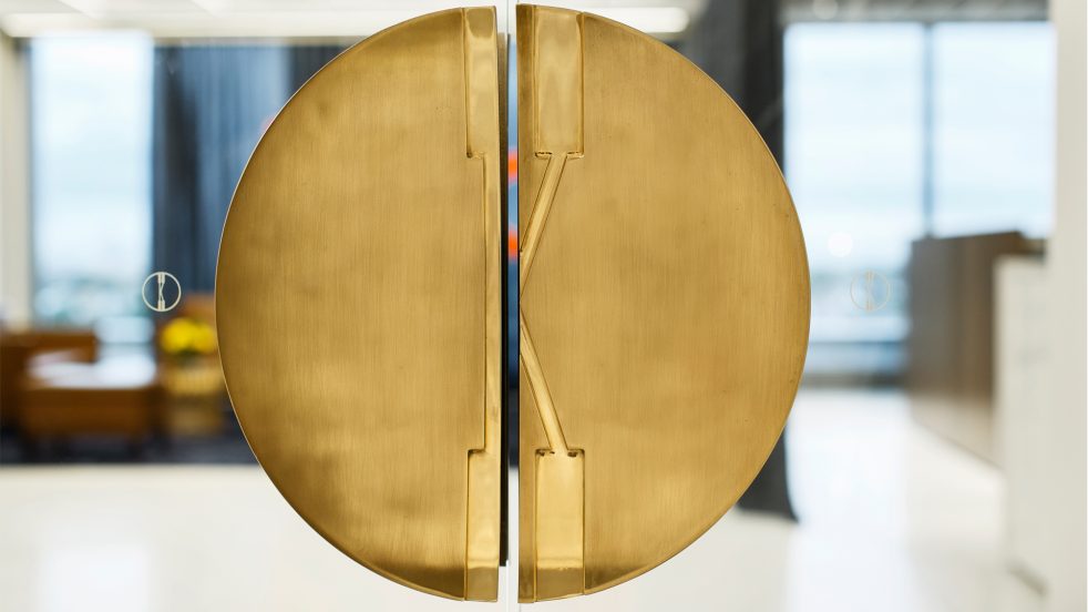 detail of the circular gold door handle that reads as a K for Knoll