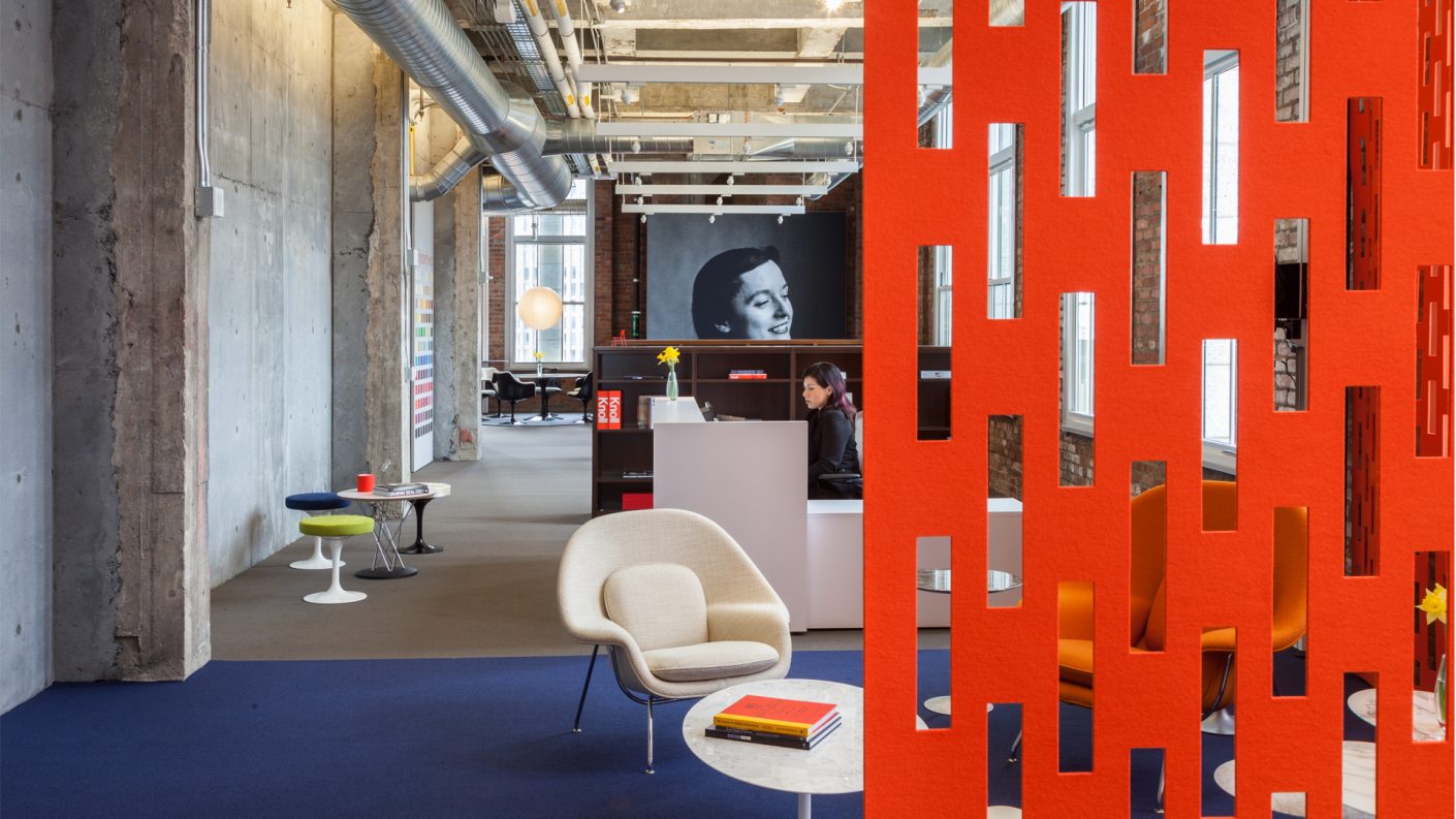 orange ARO Array partially obscures view of office and supergraphic of Florence Knoll's portrait