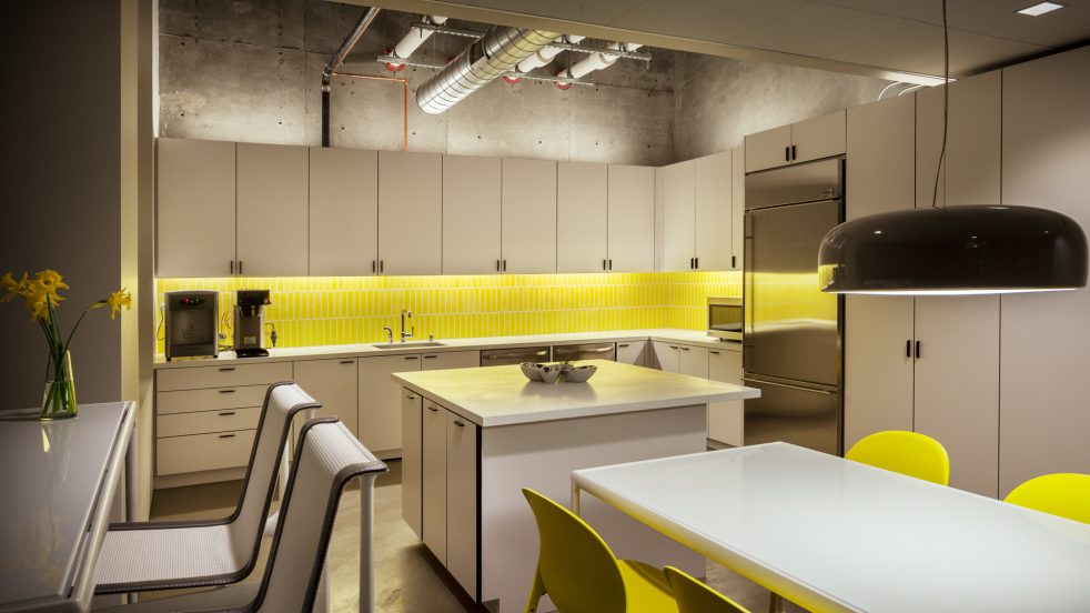 Knoll kitchen area with yellow chairs and backsplash