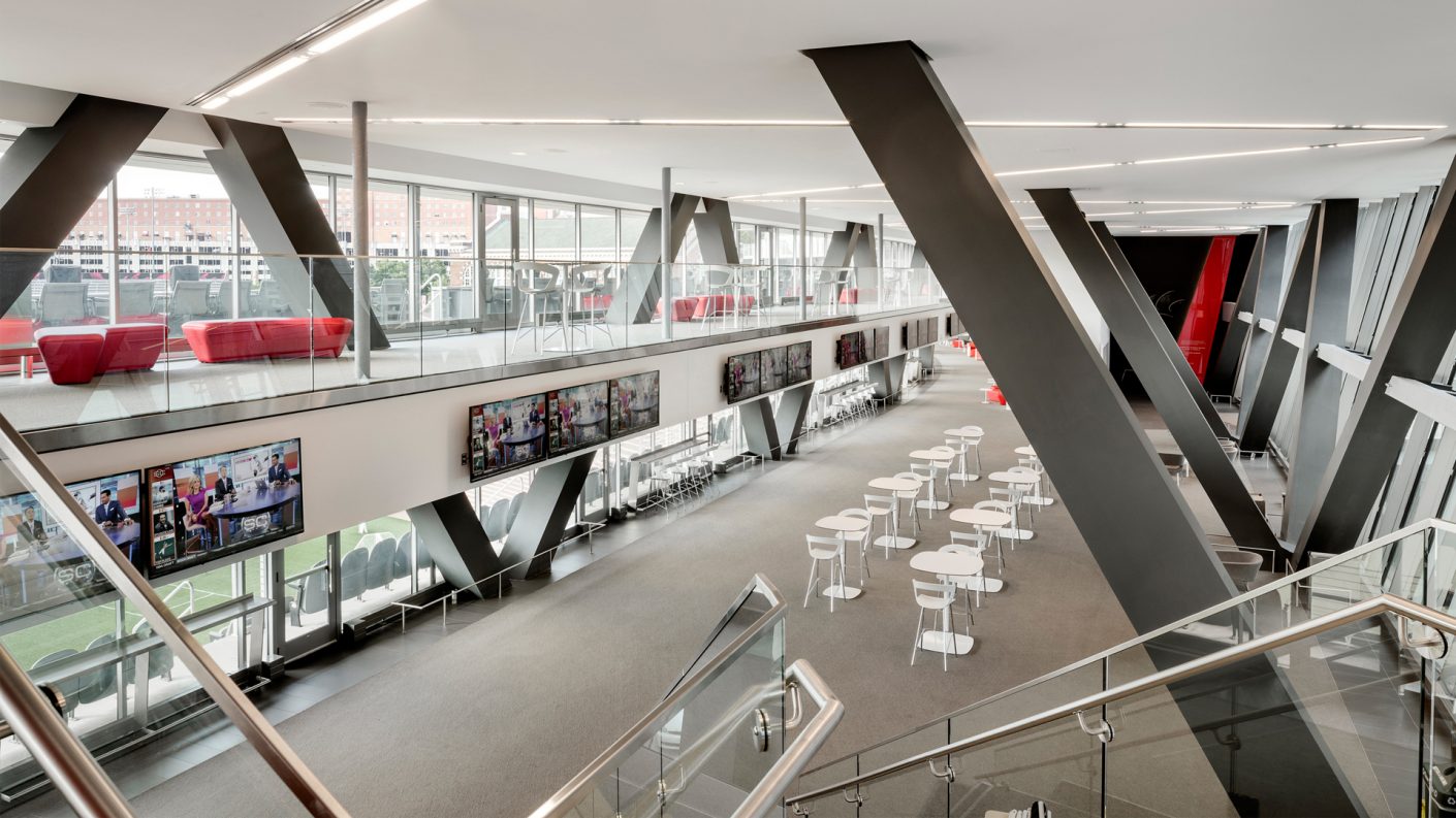 open space connecting patio level and club level featuring the building x-frames