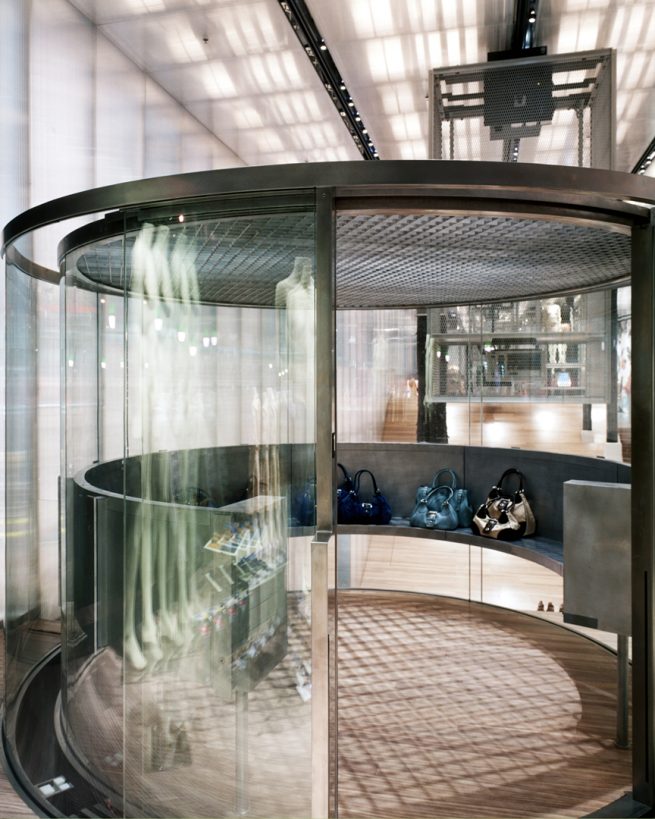 round glass elevator at Prada showroom