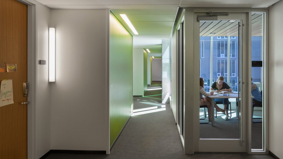 students study in designated classroom facing rooms on building upper floor