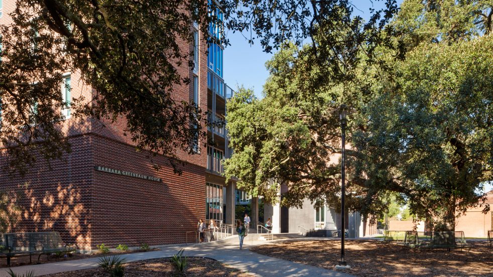 Residence hall entry near live oak trees