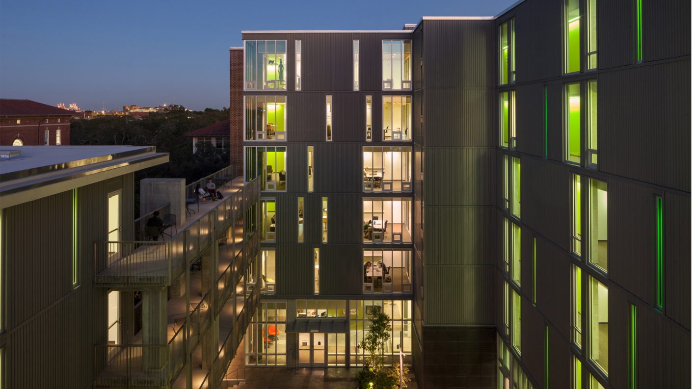 illuminated courtyard-facing façade at dusk