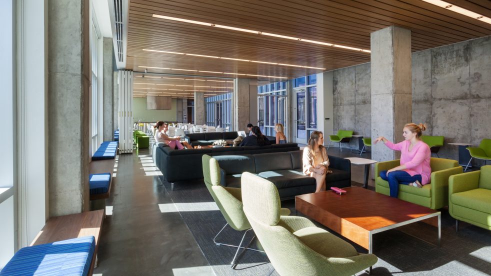 luminous flexible lounge and test kitchen in house living room under wood-panelled ceiling