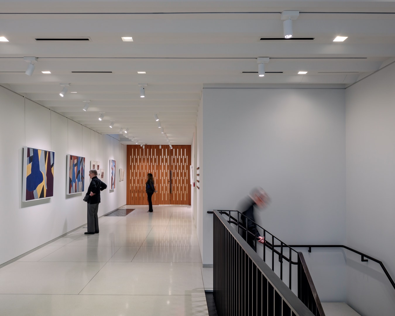 visitors reach top of staircase