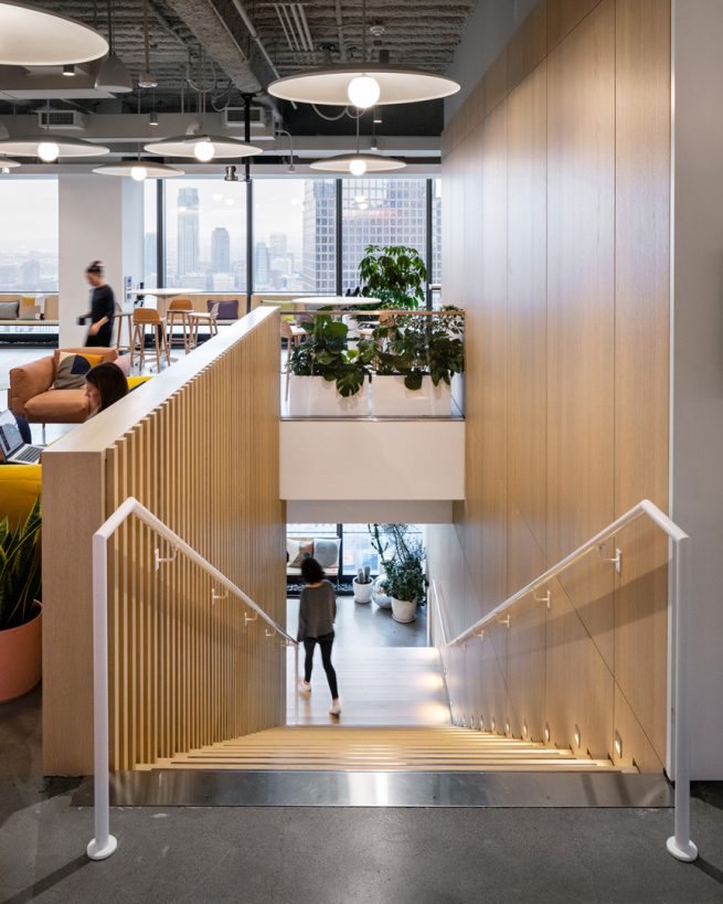 Person descends a wooden staircase