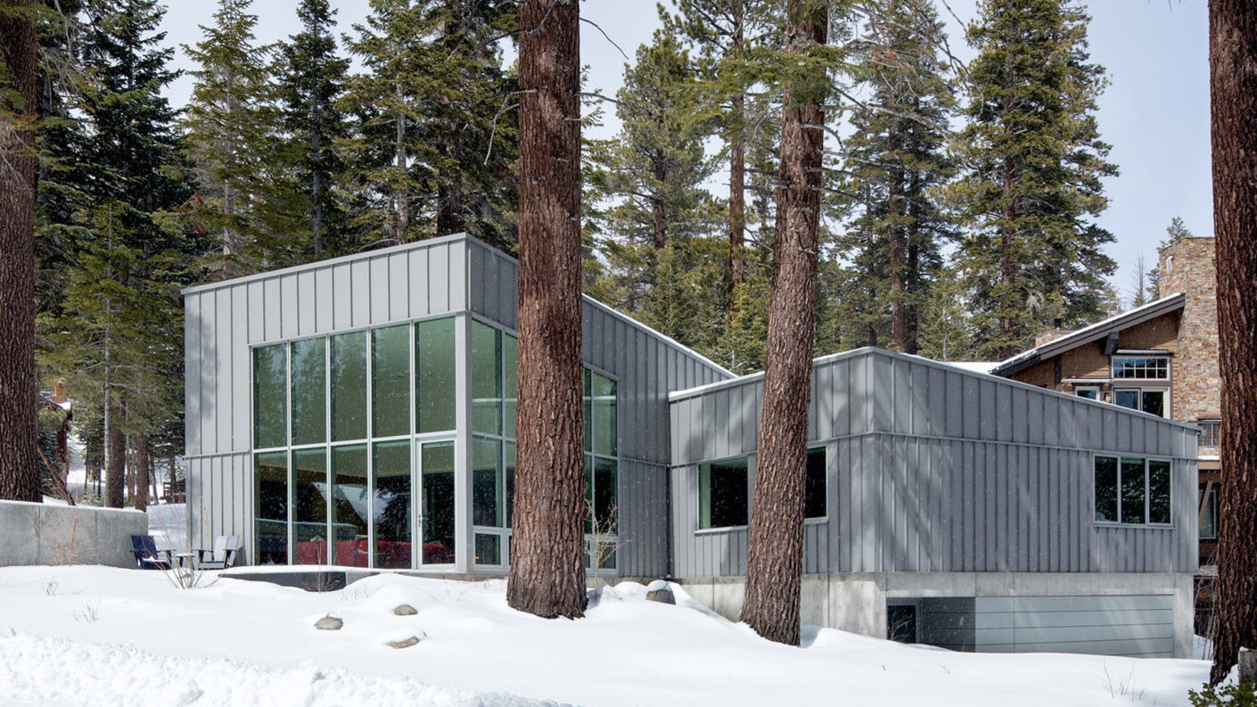 Trees and snow surround Mammoth House