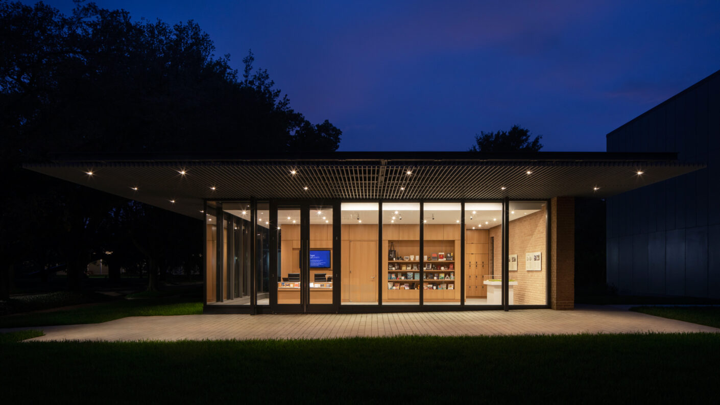 Exterior photograph of Welcome House lit up at night