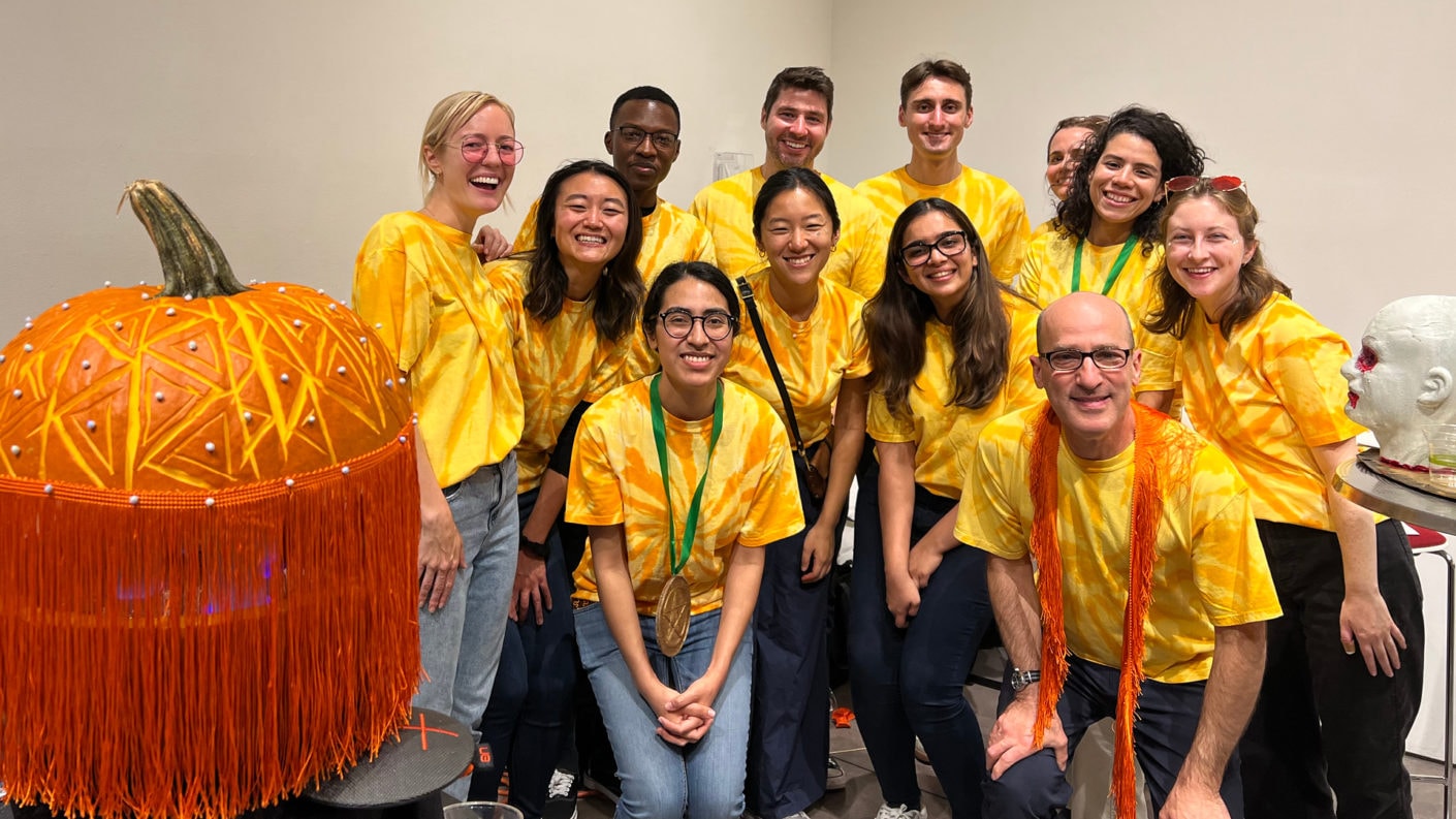 ARO's Pumpkitecture tream poses with their winning pumpkin in matching tie-dye shirts