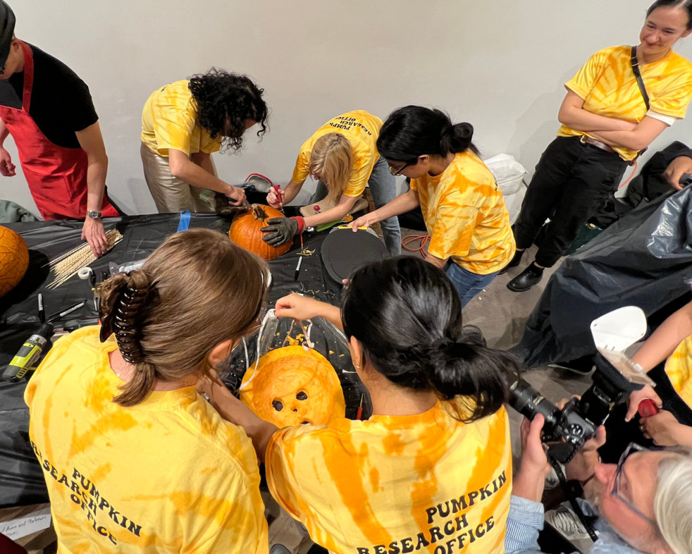 ARO's Pumpkitecture team carving the disco pumpkin