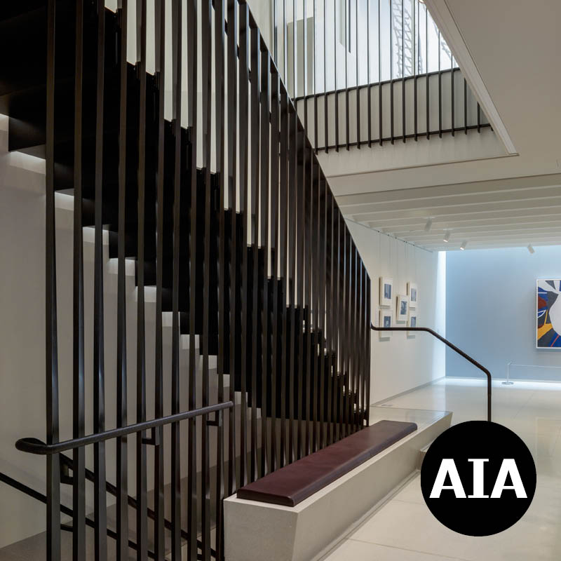 Bronze staircase and gallery interior of Vilcek Foundation.