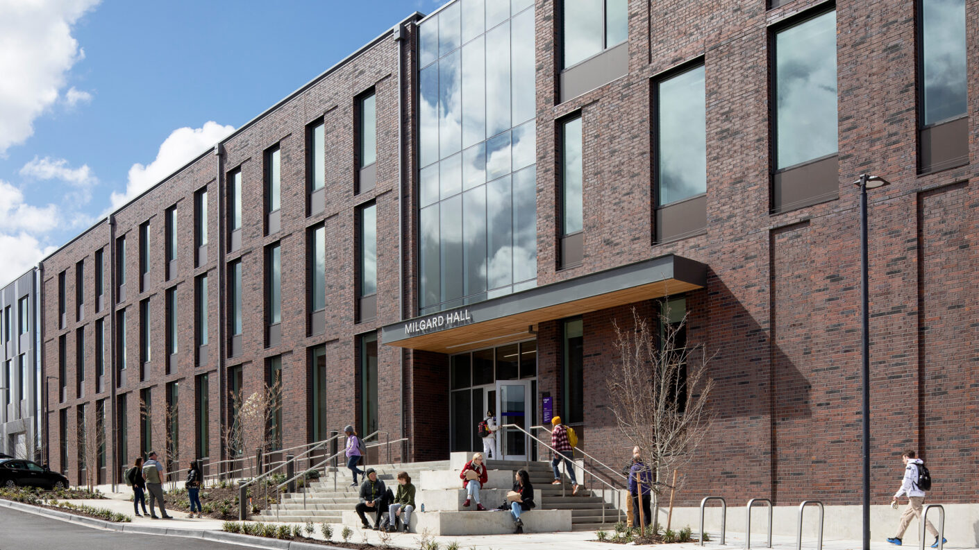 Entrance to Milgard Hall, showing brick facade and mass timber structure by Jeremy Bittermann / JBSA