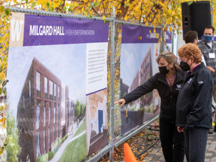 Attendees review a rendering at UW Tacoma's Milgard Hall Construction Celebration