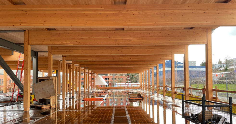 Photo of the mass timber columns, beams, and floor system being constructed for UWT's Milgard Hall