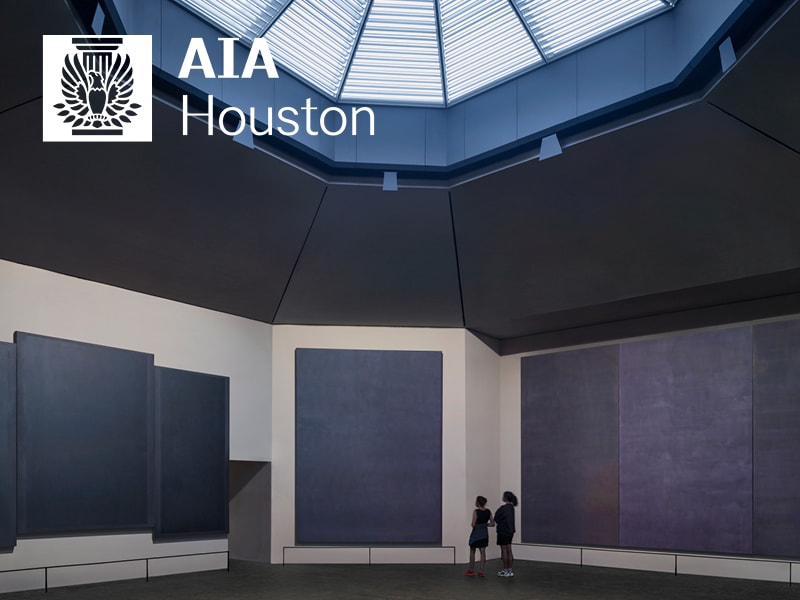 Interior view of Rothko Chapel after renovation showing visitors viewing the panels under a new skylight