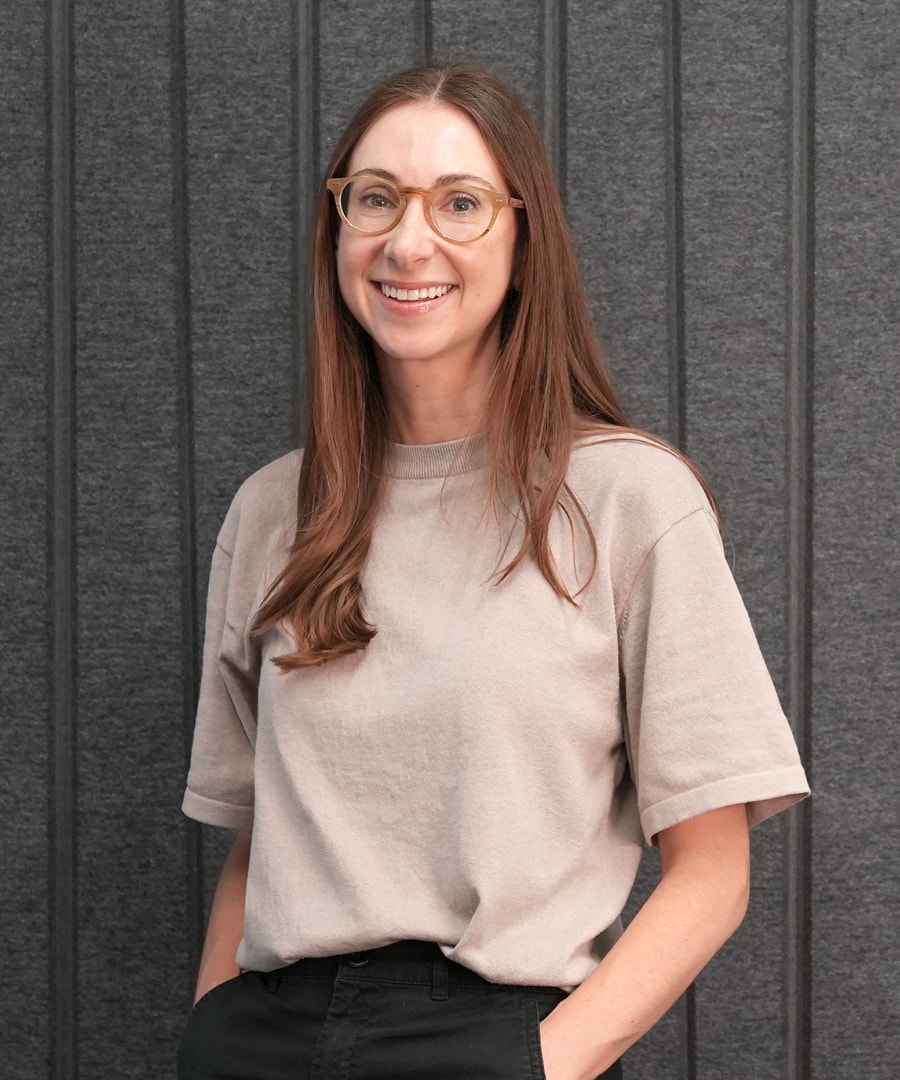 Portrait of a woman against a gray background