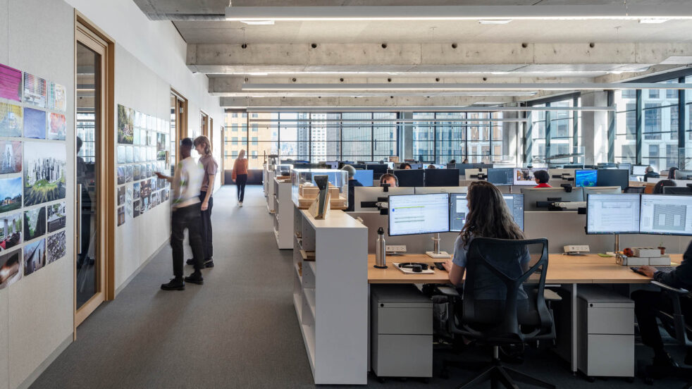 People working at desk in an open office