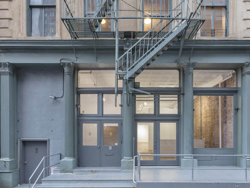 Photo of the cast iron facade of an empty gallery