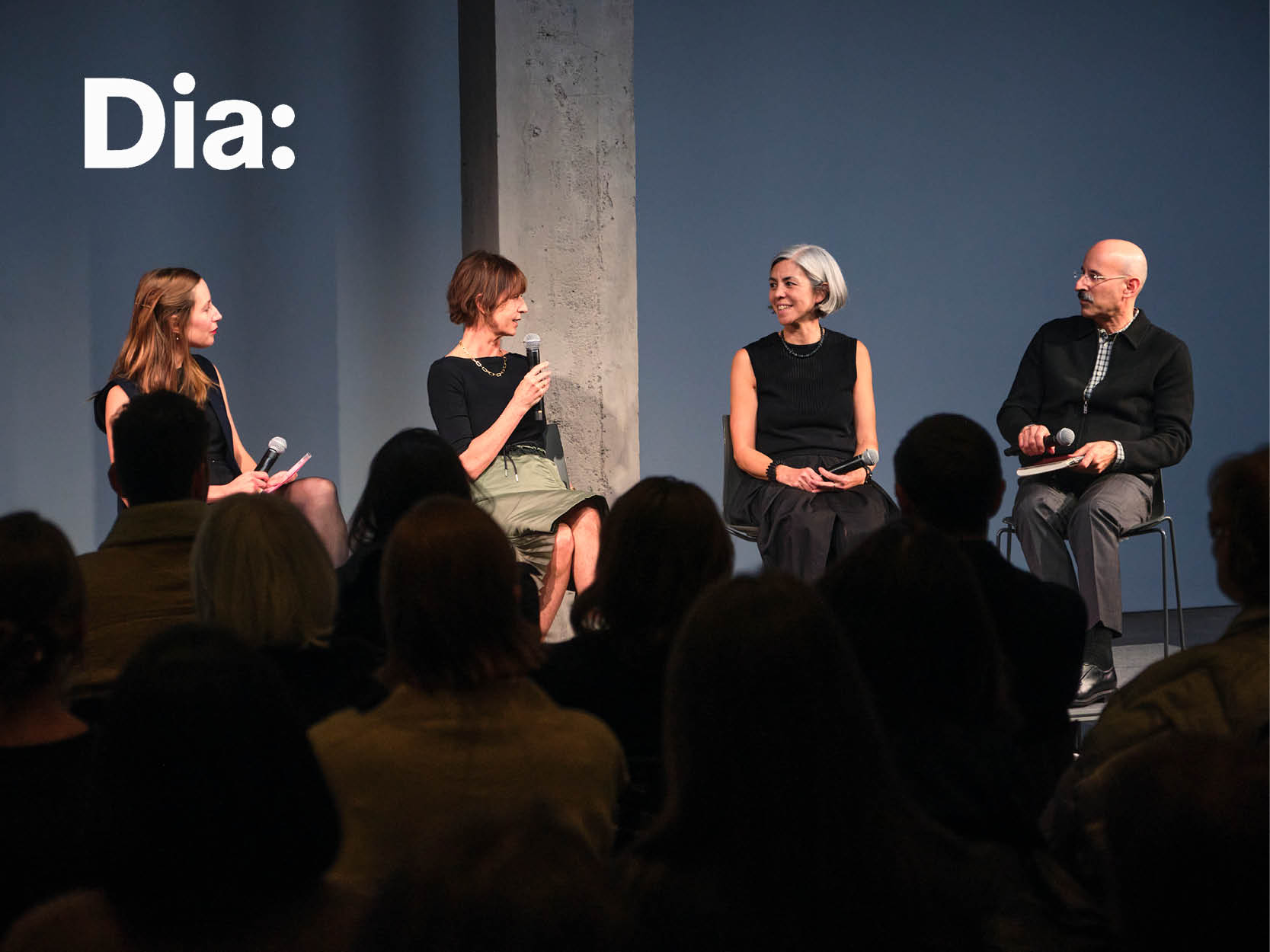 Photo of 4 people on stage in discussion. Photo credit: Don Stahl.